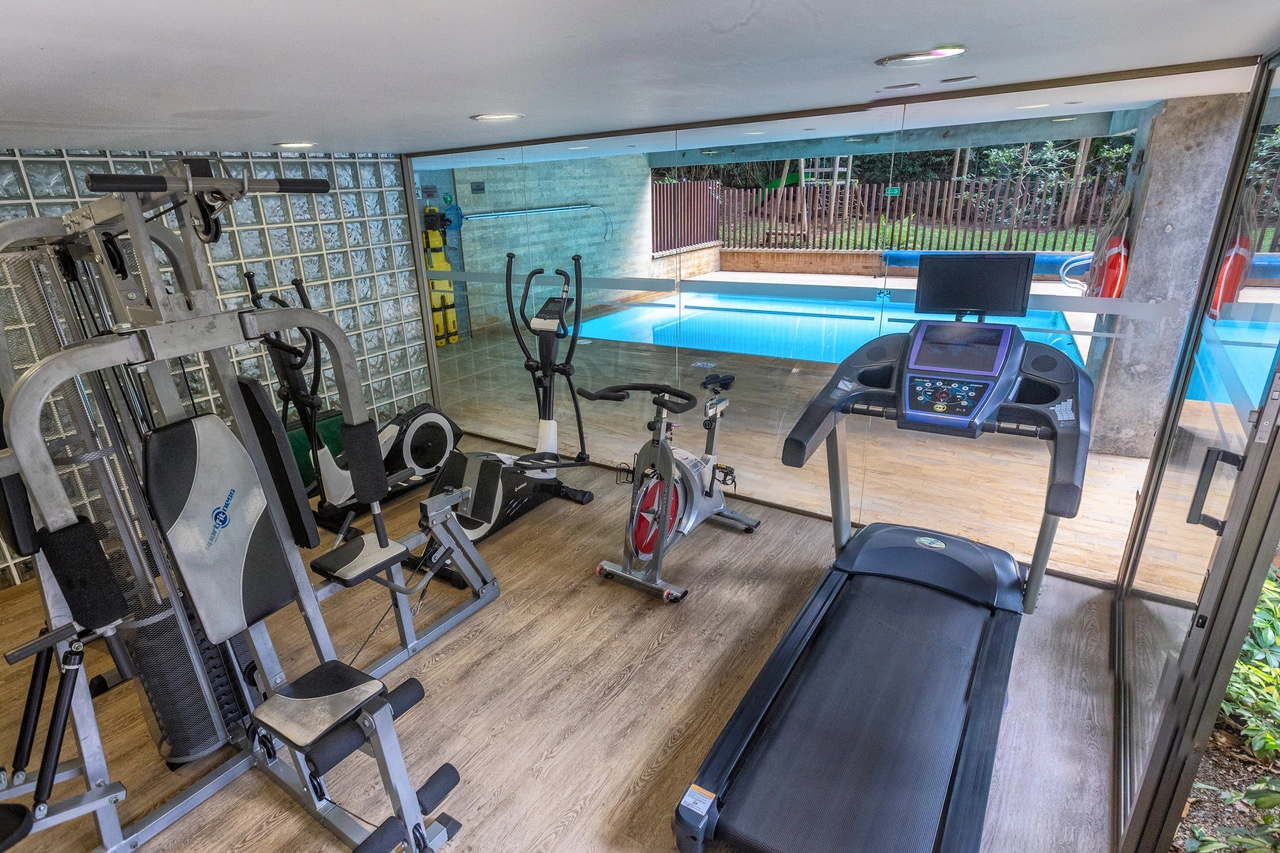 Gym with view of the pool